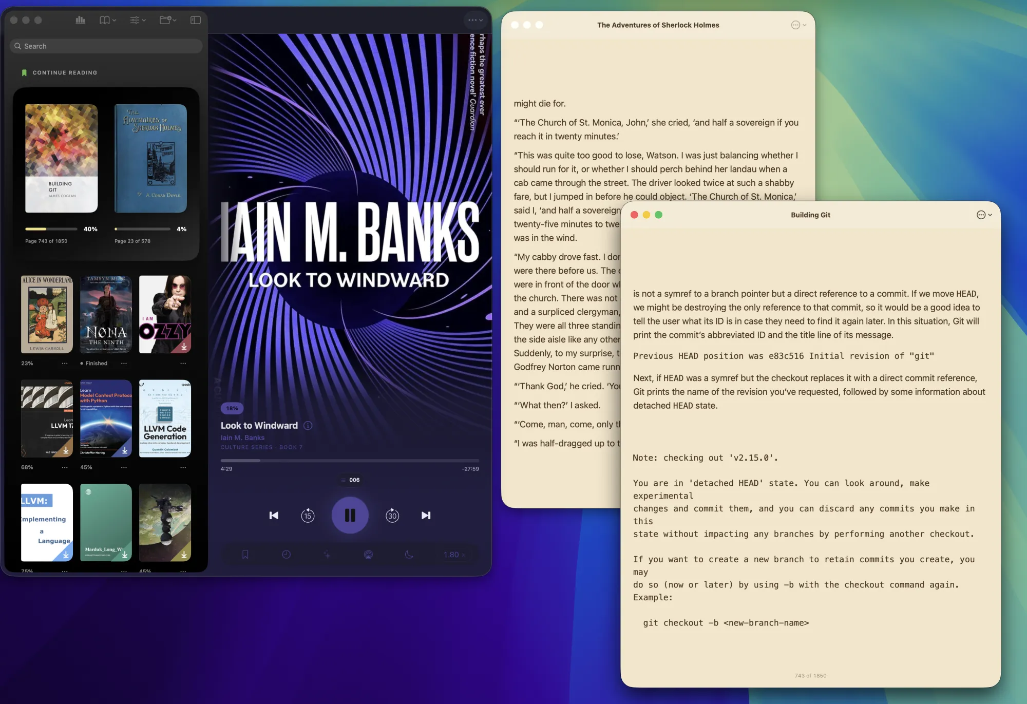 Two EPUB reader windows open next to the library